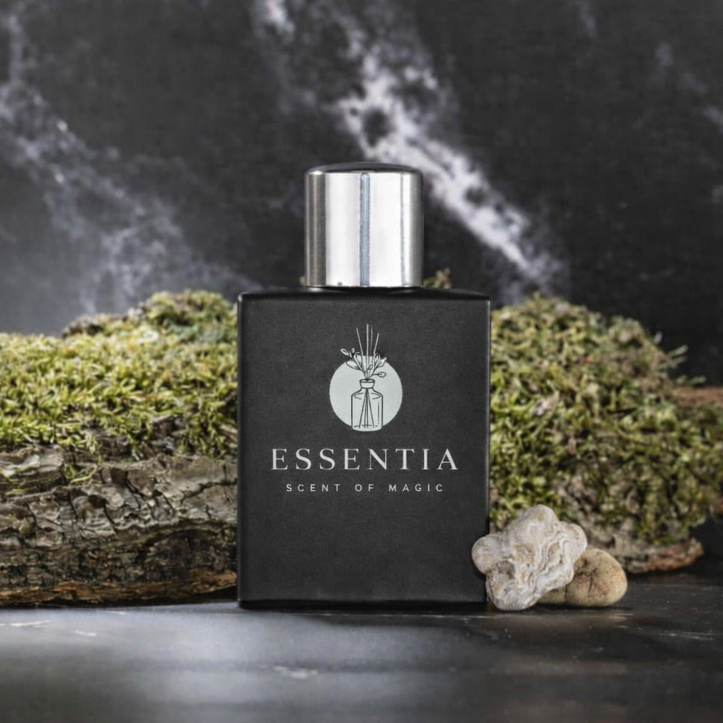 Essentia black bottle with silver cap showcasing floral woody musk fragrance surrounded by natural moss and bark